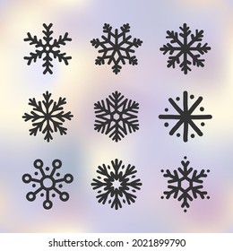 Set of hand drawn doodle snowflakes icons on winter sky gradient background. New year and winter simple symbol, cute snowflake for print, web, design, decoration, logo or mobile app.