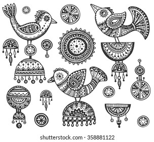 Set of hand drawn fancy birds in ethnic ornate doodle style with jewelry elements. Black and white vector illustration.