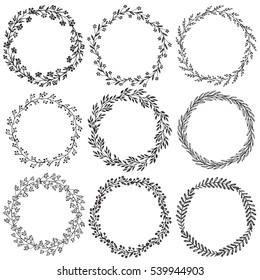Set of hand drawn floral wreaths with leaves, flowers, berries. Vector round frames. Decorative elements for design in black and white sketch style.