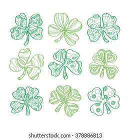 Set of hand drawn green shamrock isolated on white background. Vector illustration.