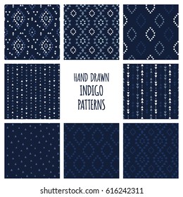 Set of hand drawn indigo blue patterns. Seamless vector navajo backgrounds with triangles, arrows, rhombuses and diamonds.