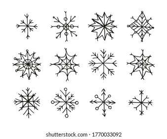 Set of hand drawn ink black snowflakes isolated on white background.