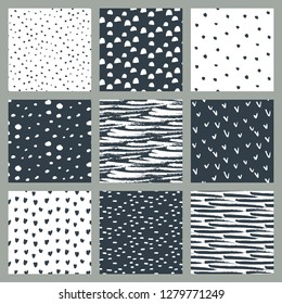 Set of hand drawn ink seamless patterns. Endless vector backgrounds of simple primitive scratchy textures with dots, stripes, hearts.