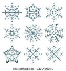 Set of hand drawn lacy blue snowflakes on a white background. Winter design elements, vector