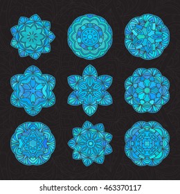 Set of hand drawn medallion blue lace pattern on black background. Ethnic colored decorative mandala. Elegant motif for save the date card, greeting card, wedding invitation. Vector illustration.