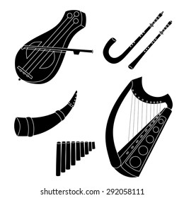 Set of hand drawn medieval musical instruments. Fiddle, harp. horn, pan flute, crumhorn, rauschpfeife. Black silhouettes technique drawing.