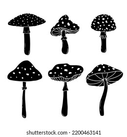 Set of hand drawn mushrooms. Fly agaric. Simple vector illustration of silhouettes.