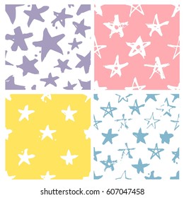 Set of hand drawn paint seamless pattern. Violet, pink, yellow, blue and white stars background. Abstract brush drawing. Grunge Vector art illustration