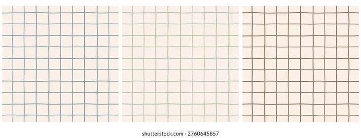 Set of hand drawn plaid seamless pattern isolated on beige background.Collection of doodle windowpane repeat pattern in blue, green and brown.Checker board background.Vector graphic wallpaper.