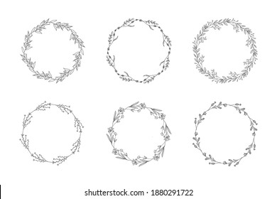 Set of hand drawn round frames and wreaths isolated on white background. Hand sketched floral design elements.