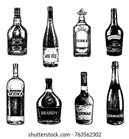 Set of hand drawn sketch style bottles of alcohol. Vector illustration isolated on white background.
