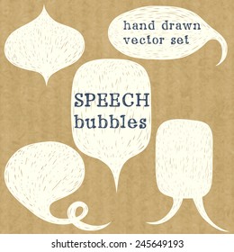Set of hand drawn speech bubbles. Doodle cartoon comic bubbles isolated on brown kraft paper background.