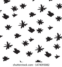 Set of hand drawn stars. Vector illustration of a repeated hand made black star. Textured monochrome wallpapaer of hand-drawn elements.