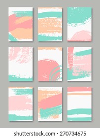 Un conjunto de plantillas de tarjetas de felicitación a mano en azul pastel, rosa y naranja. Gráficos abstractos de pincel con espacio de copia. Archivo EPS 10, malla degradada utilizada.