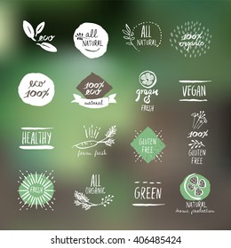 Set of hand drawn style labels and elements for organic food and drink, natural products, restaurant, healthy food market and production, on the nature background. Vector illustrations.