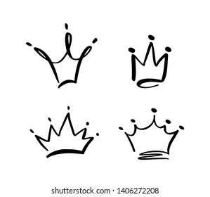 Set of hand drawn symbol of a stylized crown. Drawn with a black ink and brush. Vector illustration isolated on white. Logo design. Grunge brush stroke