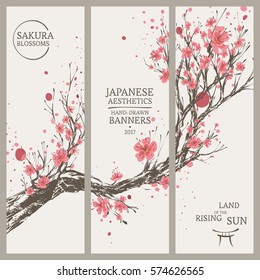 Set of Hand Drawn Vertical Banners in Japanese Style with Vivid Blooming Sakura Branch