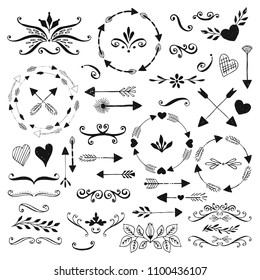 Set of hand drawn wreaths, arrows, dividers and floral elements. Vector filigree flourishes. Isolated.