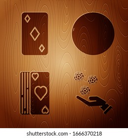 Set Hand holding casino chips, Playing card with diamonds symbol, Deck of playing cards and Casino roulette wheel on wooden background. Vector