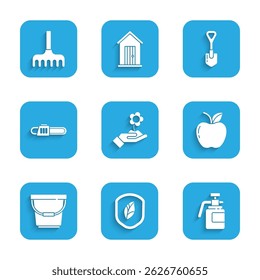 Set Hand holding flower, Shield with leaf, Garden sprayer for fertilizer, Apple, Bucket, Chainsaw, Shovel and rake icon. Vector