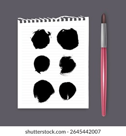 Set of hand painted brush strokes on white piece of notebook