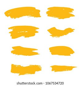 Set of Hand Painted Golden Brush Strokes. Gold Vector Grunge Brushes. Vector Frame For Text Modern Art Graphics For Hipsters.  Dirty Artistic Creative Design Elements. Perfect For Logo, Banner.