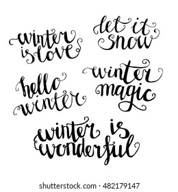 Set of hand written words about winter. Hand lettering isolated on white background. Winter is love. Let it snow. Hello winter. Winter magic. Winter is wonderful.