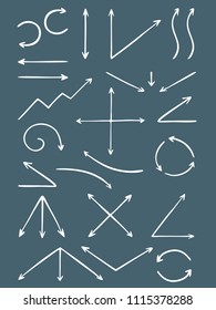 Set of hand-drawn arrows. The effect of a pencil sketch isolated on blue background. Vector design elements.