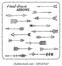 Set of hand-drawn arrows. Ethnic arrows isolated on white background. Black and white illustration.