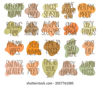 Set of hand-drawn autumn hygge mood lettering phrases. Cozy cute motivational phrases isolated on white background for seasonal decoration.