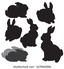  set of hand-drawn black silhouettes of rabbits isolated on a white background, for decoration of Easter holidays