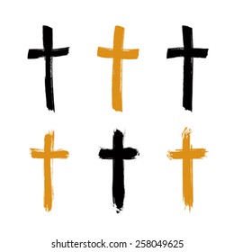 Set of hand-drawn black and yellow grunge cross icons, collection of simple Christian cross signs, hand-painted cross symbols created with real ink brush isolated on white background.