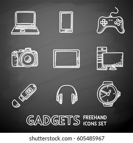 Set of handdrawn blackboard GADGET icons with - notebook and phone, gamepad, photo camera, tablet, pc, flash card, headphones, watches. Vector illustration