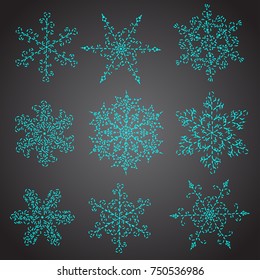 Set of hand-drawn blue snowflake with curls embroidered of intermittent dashes