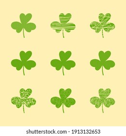 Set of hand-drawn clover leaves in grunge style.Collection of magical plant Shamrock.Decoration for St. Patrick's Day,trefoils and quatrefoils with different textures.Irish story.Isolated, vector