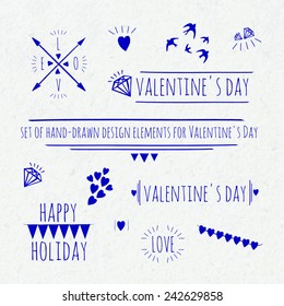 set of hand-drawn design elements for Valentine's Day on a watercolor paper