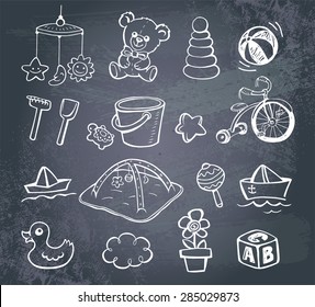 Set of hand-drawn doodle icons baby toys and accessories on a blackboard..