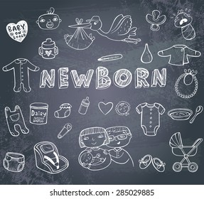 Set of hand-drawn doodles baby toys, food, accessories on a blackboard..