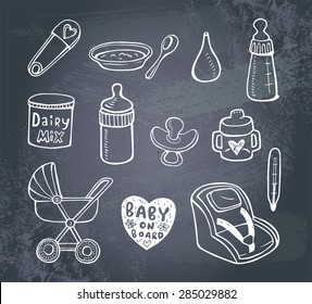 Set of hand-drawn icons baby  food and accessories on a blackboard..