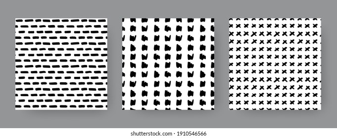 Set of hand-drawn seamless black and white patterns with crosses, dashes and stripes. Vector repeat backgrounds.