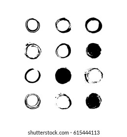 Set of handmade paint grungy circle shapes. Vector design elements.