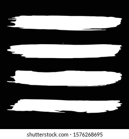 Set of hand-painted brush strokes. Black and white background.