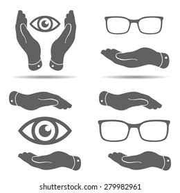 set of hands, eyes and glasses on a white background