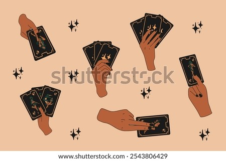 A set of hands holding tarot cards with different symbols