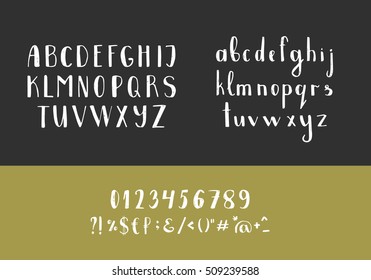 Set of handwritten latin letters. Vector script font. White alphabet isolated on black background.
