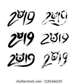 Set of Handwritten lettering of 2019. Happy New Year. Calligraphy. Pig ears and snout