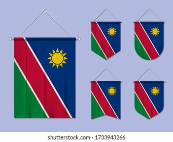 Set of hanging flags Namibia with textile texture. Diversity shapes of the national flag country. Vertical template pennant for banner, web, logo, award and festival