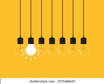 Set of hanging light bulbs with one glowing. Leadership, power and uniqueness concept.