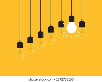 Set of hanging light bulbs with one glowing. Leadership, power and uniqueness concept.