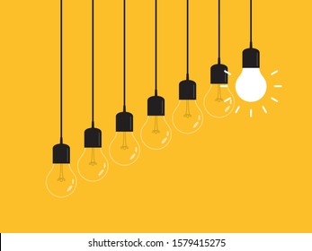 Set of hanging light bulbs with one glowing. Leadership, power and uniqueness concept.